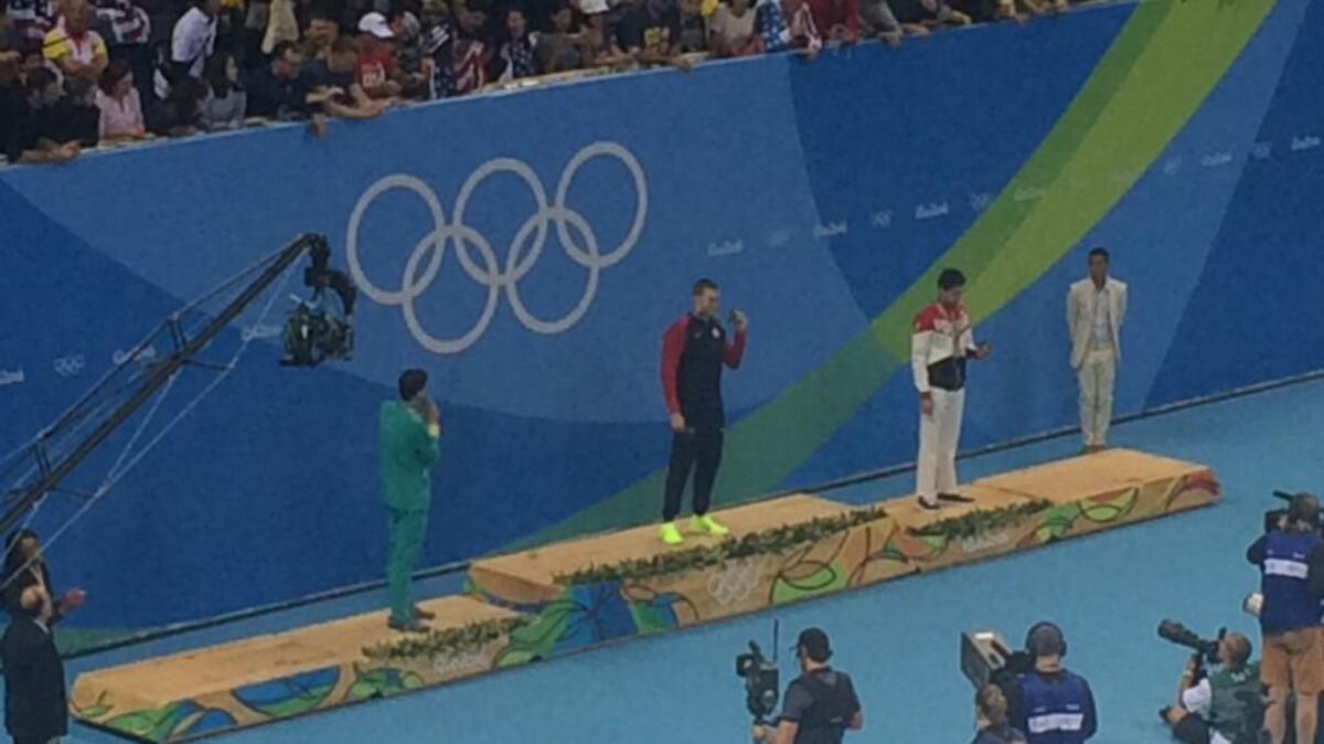 American swimmer Ryan Murphy receives his gold medal in the 200 backstroke Friday night in Rio de Janeiro