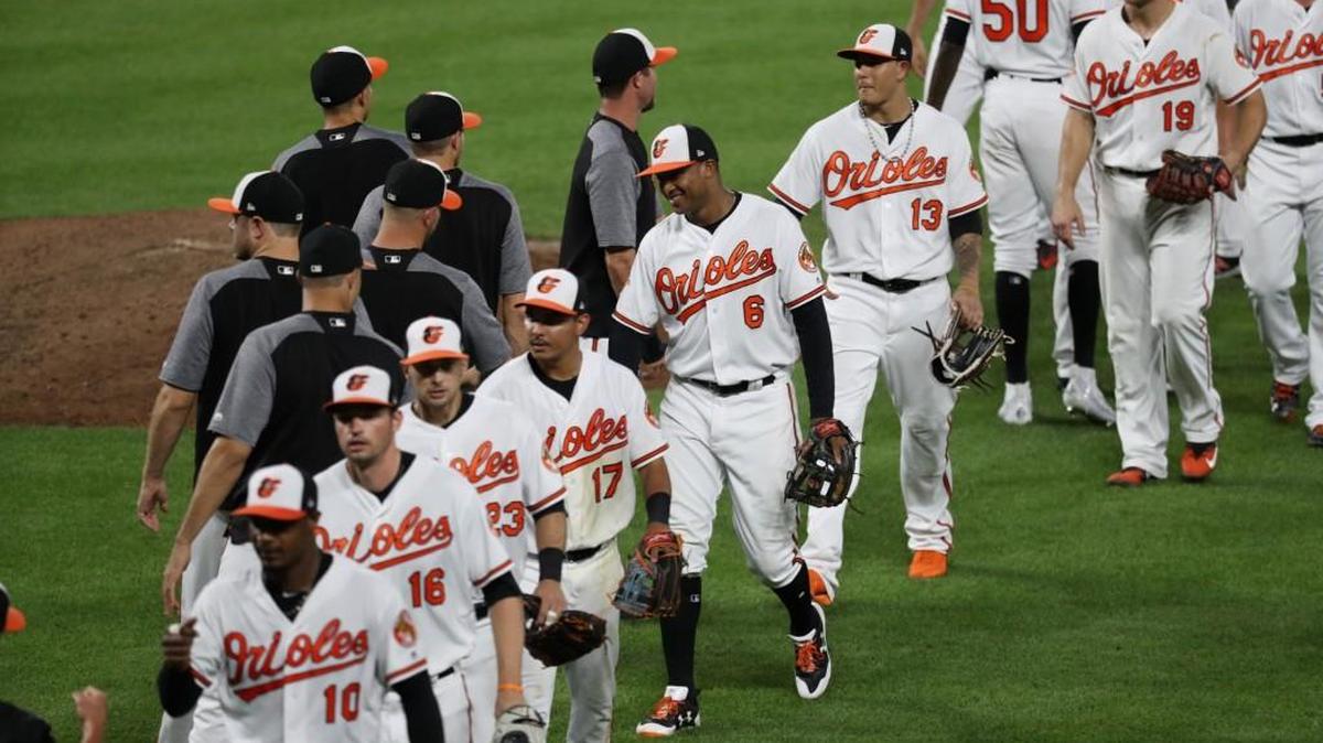 Jonathan Schoop #6 of the Baltimore Orioles celebrates with teammates after the Orioles defeated the Texas Rangers 9-7 at Oriole Park at Camden Yards on July 20, 2017 in Baltimore. (Photo by Rob Carr/Getty Images)