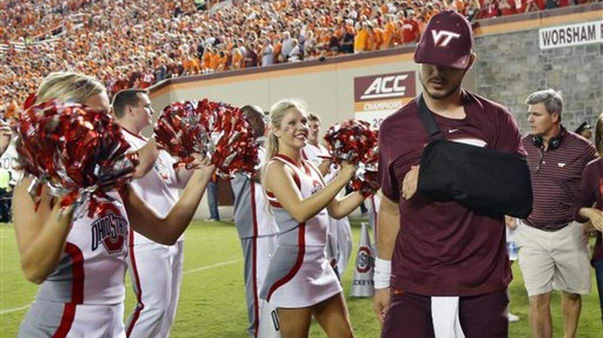 Virginia Tech quarterback Michael Brewer (12) walks out of a medical facility during the second half of an NCAA college football game against Ohio State in Blacksburg, Va., Monday, Sept. 7, 2015. Brewer hurt his shoulder during the third quarter.