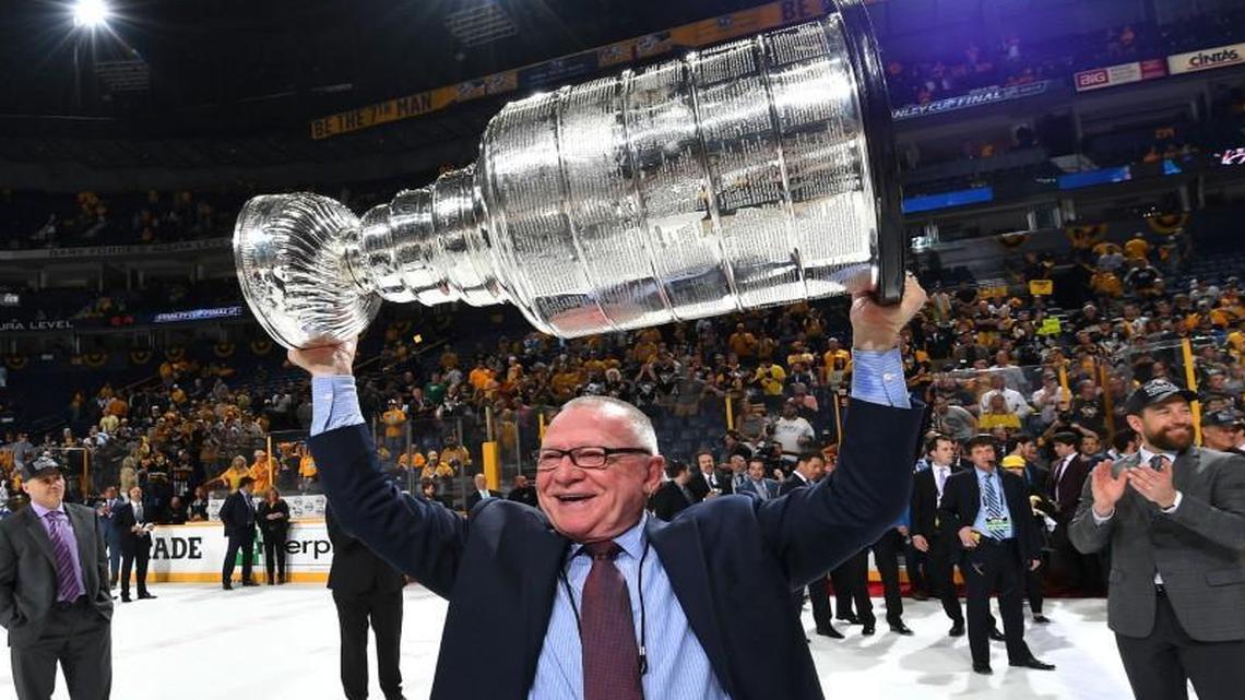 General Manager Jim Rutherford of the Pittsburgh Penguins lifts the Stanley Cup after Game Six of the 2017 NHL Stanley Cup Final at the Bridgestone Arena on June 11, 2017 in Nashville, Tennessee.