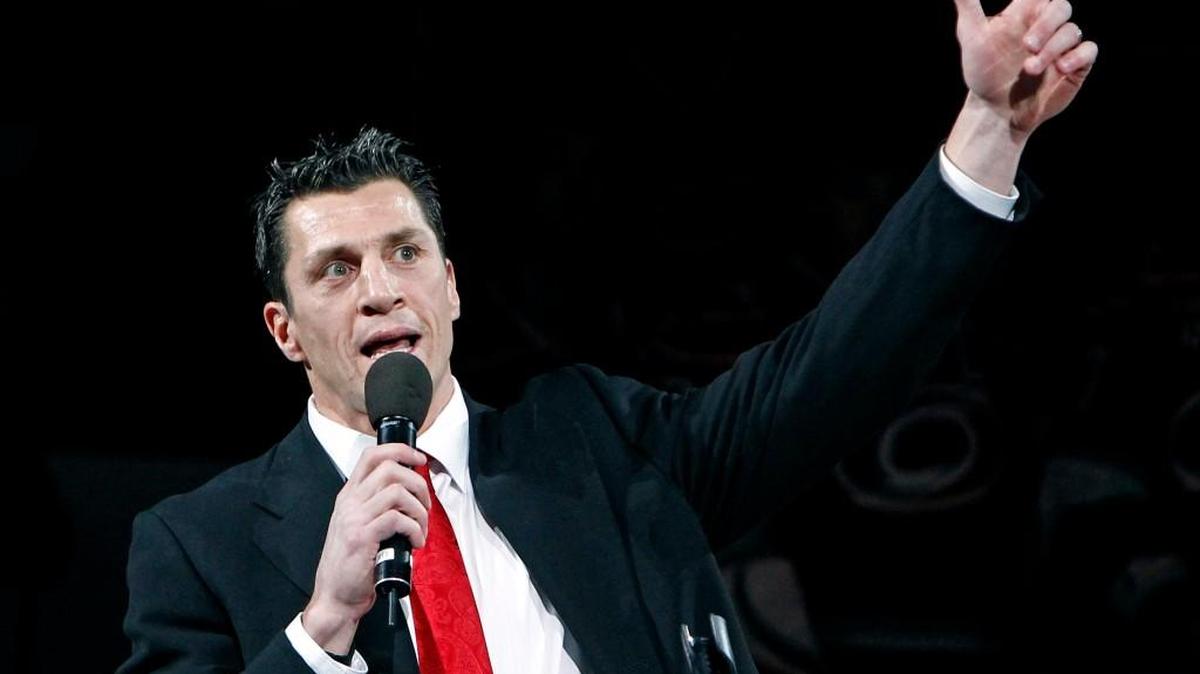 Former Hurricanes captain Rod Brind'Amour points to the Stanley Cup banner as he speaks as his number is retired before an NHL game played between the Carolina Hurricanes and the Philadelphia Flyers at the RBC Center in Raleigh on Feb. 18, 2011.