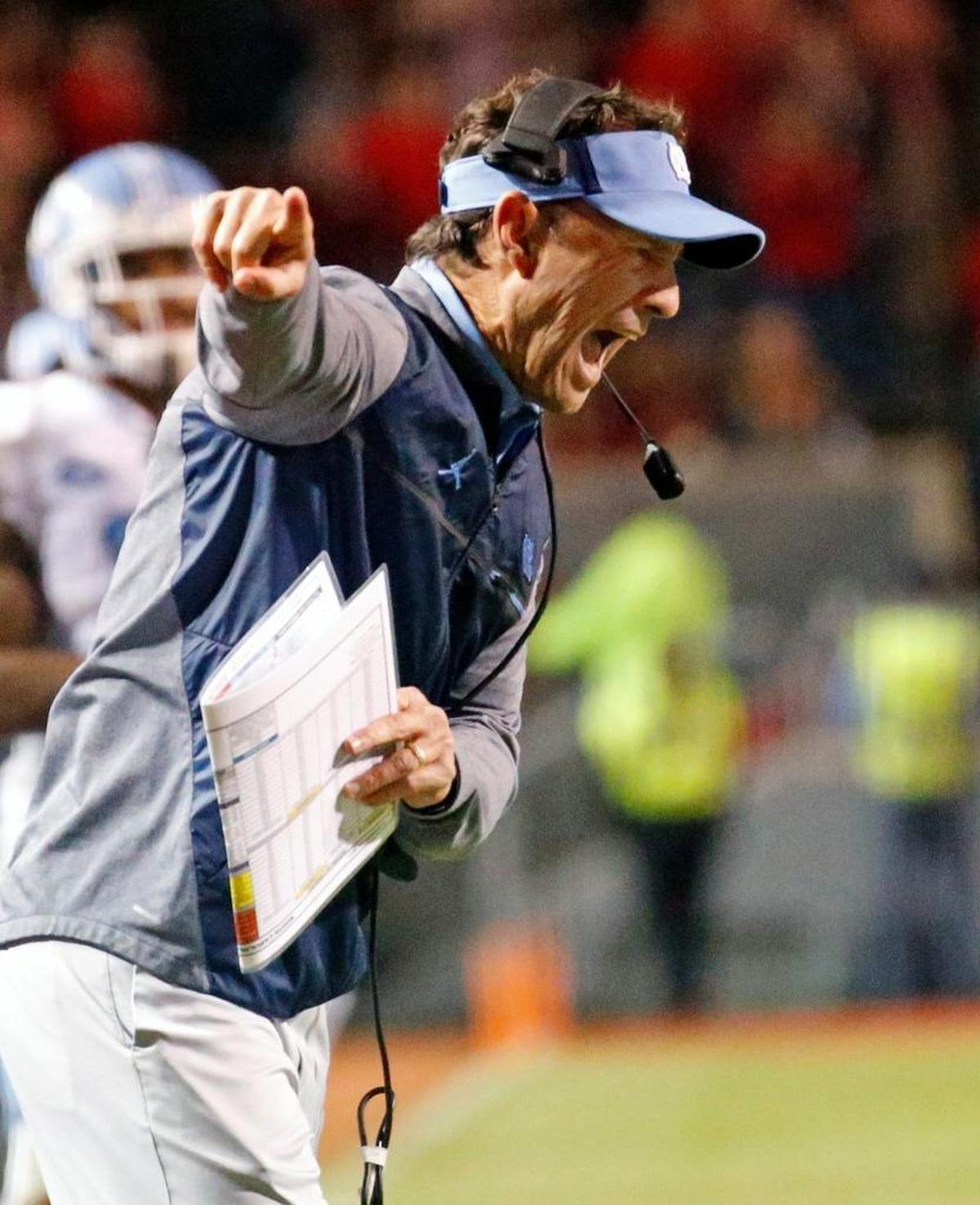 UNC head coach Larry Fedora gets worked up over a call during the fourth quarter of an ACC college football game between the N.C. State UNC at Carter-Finley Stadium on Nov. 25, 2017.