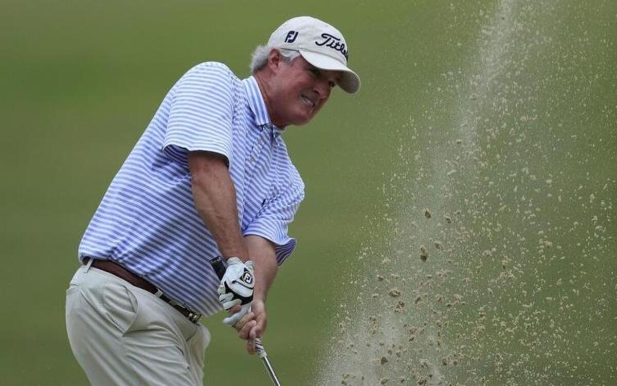 
CARY, NC - OCTOBER 13: Russ Cochran hits his third shot on the 13th hole from a bunker during the final round of the SAS Championship held at Prestonwood Country Club on October 13, 2013 in Cary, North Carolina. (Photo by Michael Cohen/Getty Images)
