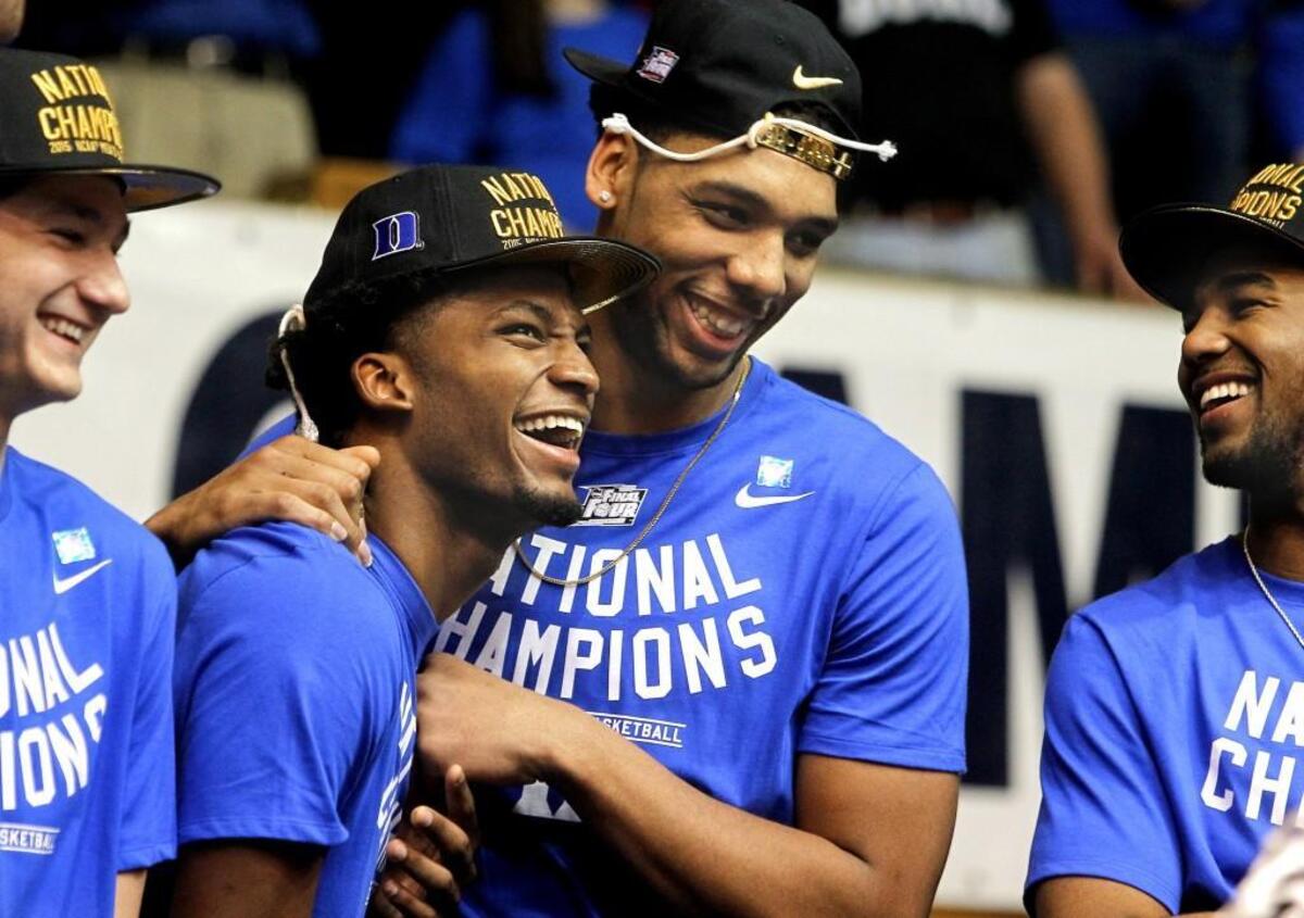 Flanked by Grayson Allen, far left, and Matt Jones, far right, Duke freshman Justise Winslow, center left, and Jahlil Okafor, enjoy the welcome home celebration in Durham in front of thousands. The Duke Blue Devils basketball team returned to campus heroes on Tuesday, April 7, 2015 after winning the NCAA National Championship in Indianapolis the night before against the Wisconsin Badgers.