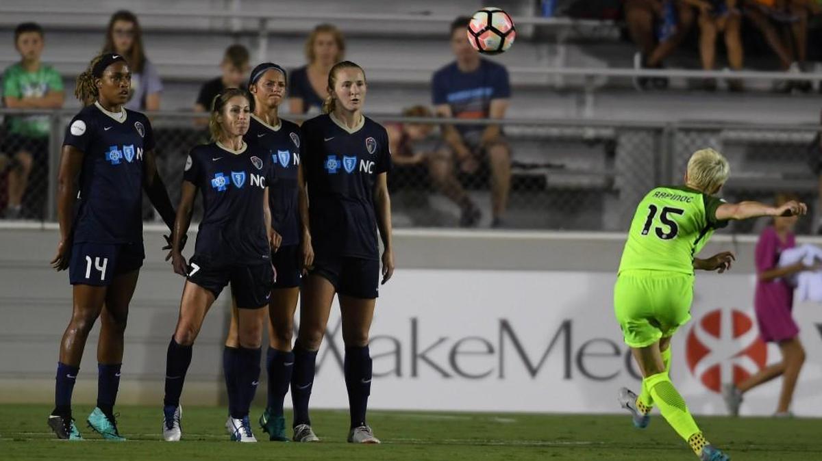 Jessica McDonald (14), McCall Zerboni, second from left, Ashley Hatch, third from left, and Samantha Mewis, fourth from left, of North Carolina Courage set up a wall against a free kick shot by Megan Rapinoe (15) of Seattle Reign at the WakeMed Soccer Park in Cary on Saturday, July 8, 2017. North Carolina Courage won 2-0.