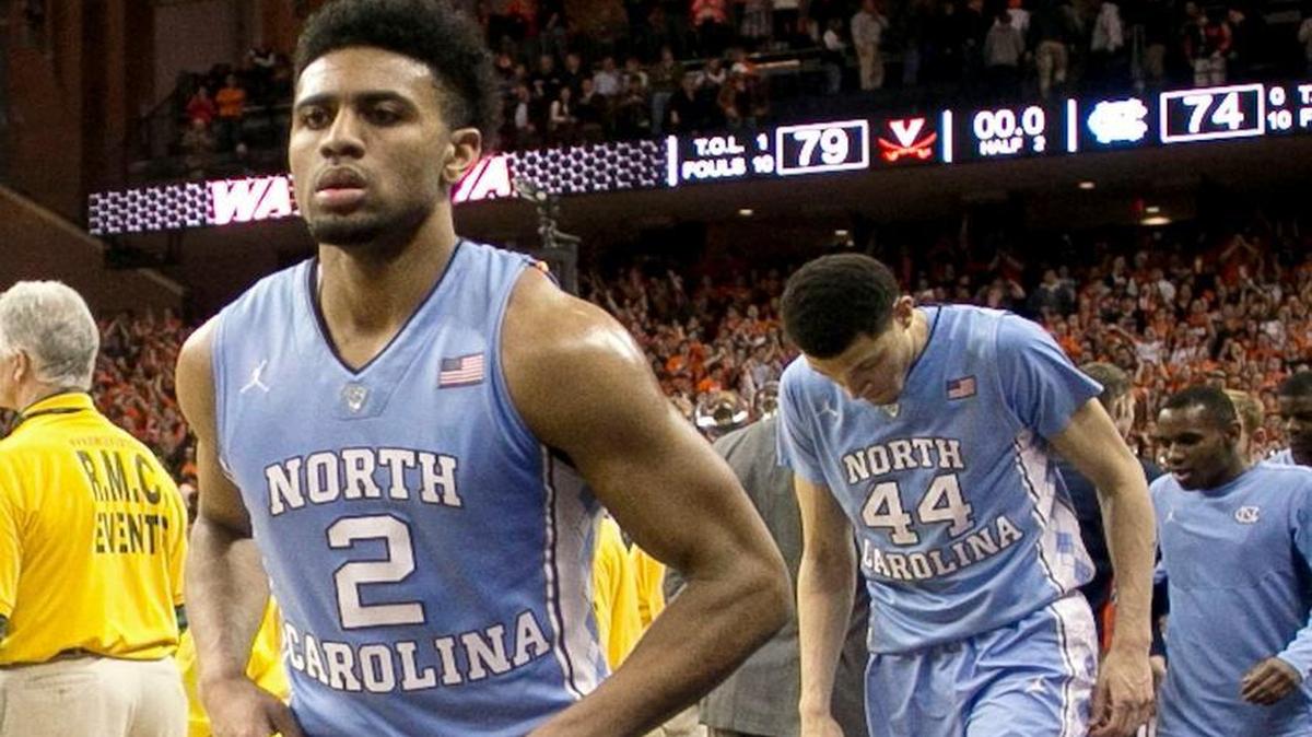 North Carolina’s Joel Berry leaves the court with his teammates following the Tar Heels’ 79-74 loss to Virginia at John Paul Jones Arena.