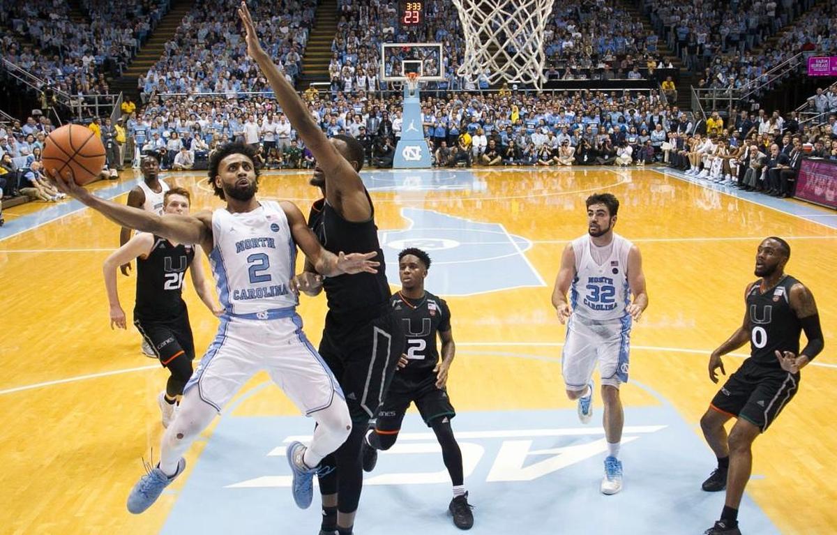 North Carolina’s Joel Berry II (2) drives to the basket against Miamiís Dewan Huell (20) on Tuesday, February 27, 2018 at the Smith Center in Chapel Hill, N.C.