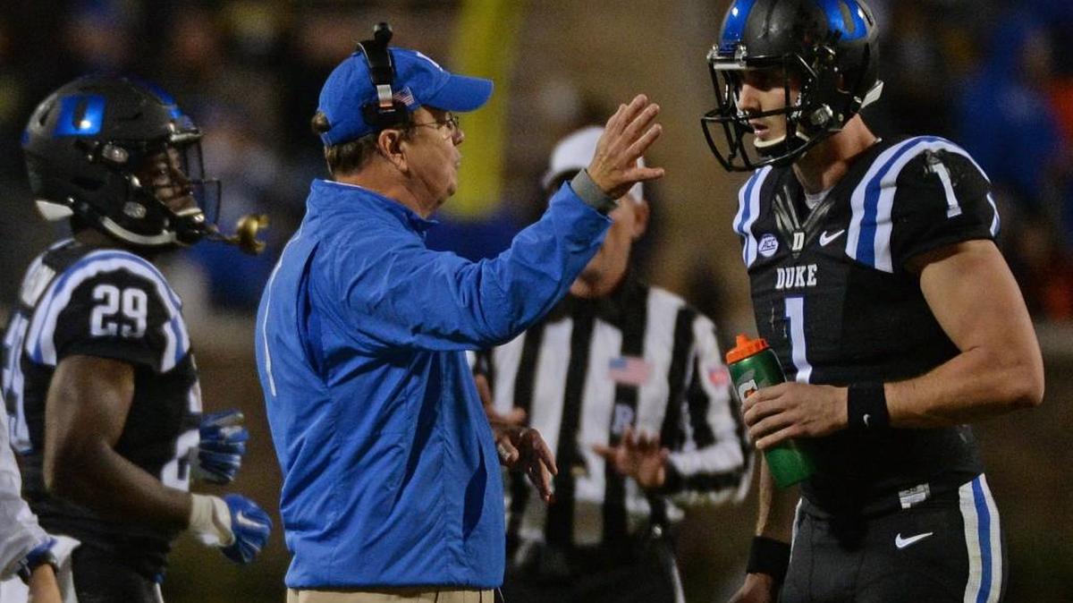 Duke head coach David Cutcliffe speaks with quarterback Thomas Sirk (1) after a botched play in the second quarter at Wallace Wade Stadium in Durham, N.C. Saturday, October 31, 2015.