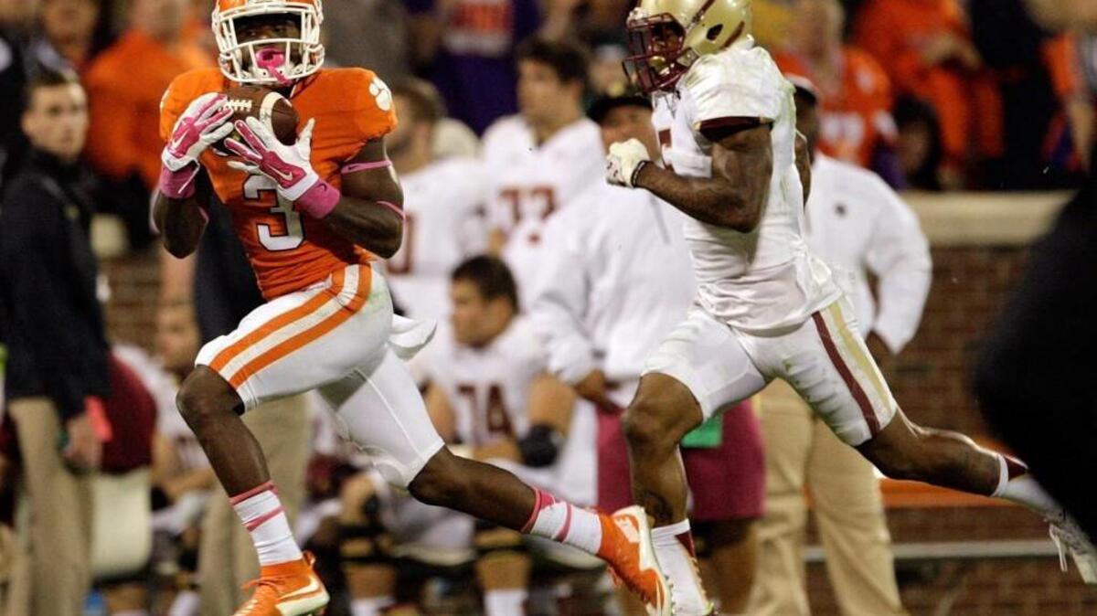 Clemson’s Artavis Scott, left, catches a pass for a touchdown against Boston College on Oct. 17. The Tigers have a good shot at going 13-0 and claiming a College Football Playoff semifinal spot.