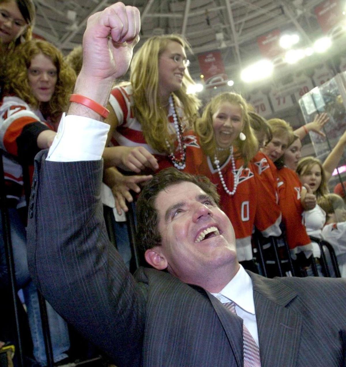 Fans cheer the Canes head coach Peter Laviolette as he leaves the ice after the Carolina Hurricanes beat the Edmonton Oilers in Game 7 of the Stanley Cup at the RBC Center on June 19, 2006. The Canes won 3-1 to win the Stanley Cup. staff/Chris Seward