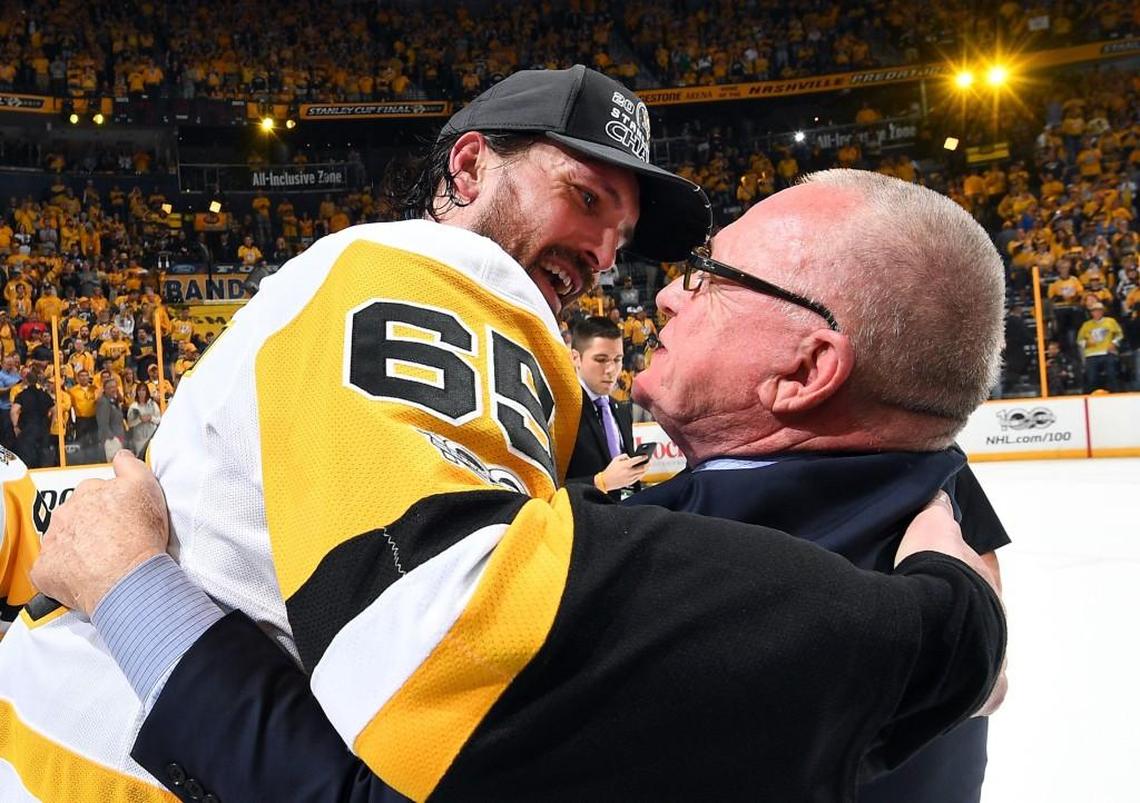 General Manager Jim Rutherford of the Pittsburgh Penguins hugs Ron Hainsey after Game Six of the 2017 NHL Stanley Cup Final at the Bridgestone Arena on June 11, 2017 in Nashville, Tennessee. The Penguins defeated the Predators 2-0.