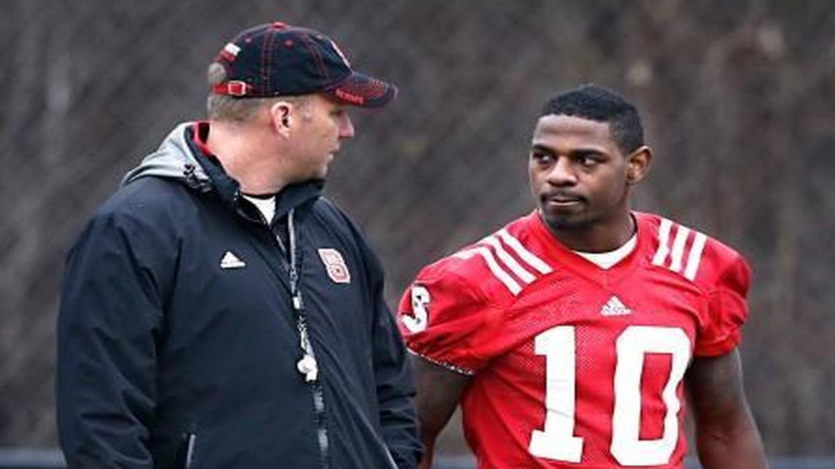 
N.C. State head coach Dave Doeren talks with running back Shadrach Thornton (10) after N.C. State football's first spring practice at the Dail football practice complex in Raleigh, N.C., Tuesday, March 3, 2015. 
