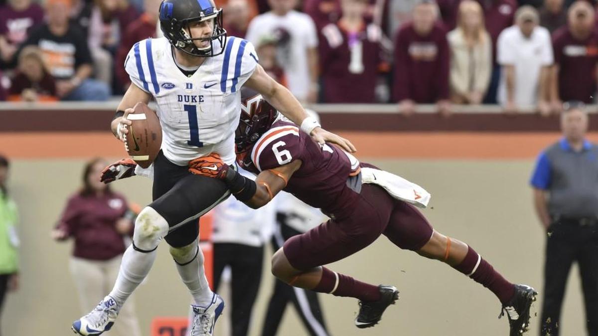 Duke quarterback Thomas Sirk scrambles away from Virginia Tech cornerback Mook Reynolds Lane Stadium in Blacksburg.