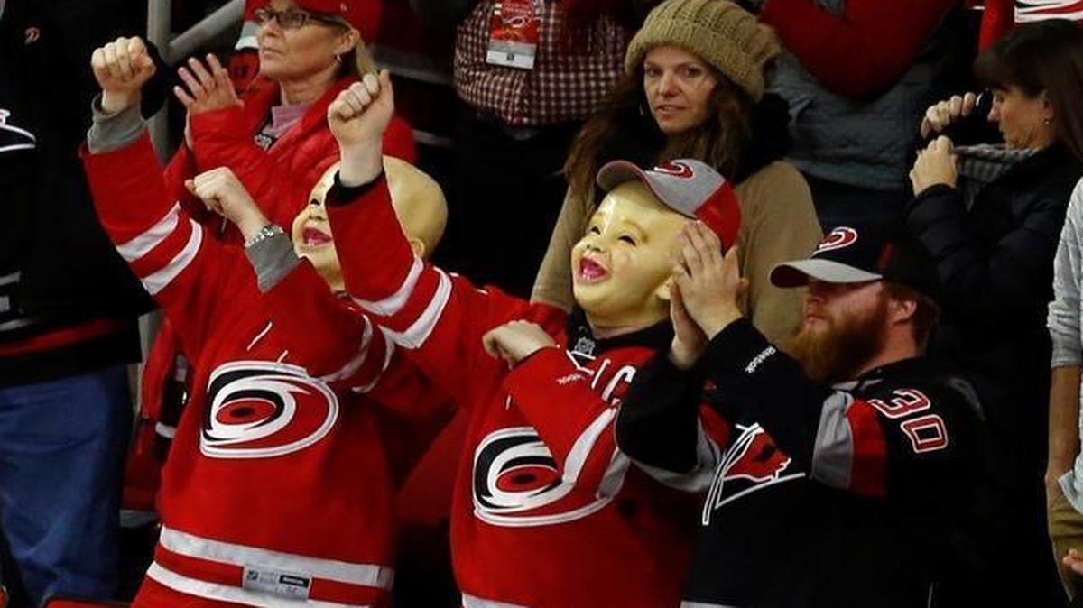 Canes fans cheer for the team in the closing moments Canes 3-1 win over the Winnipeg Jets at PNC Arena in Raleigh.