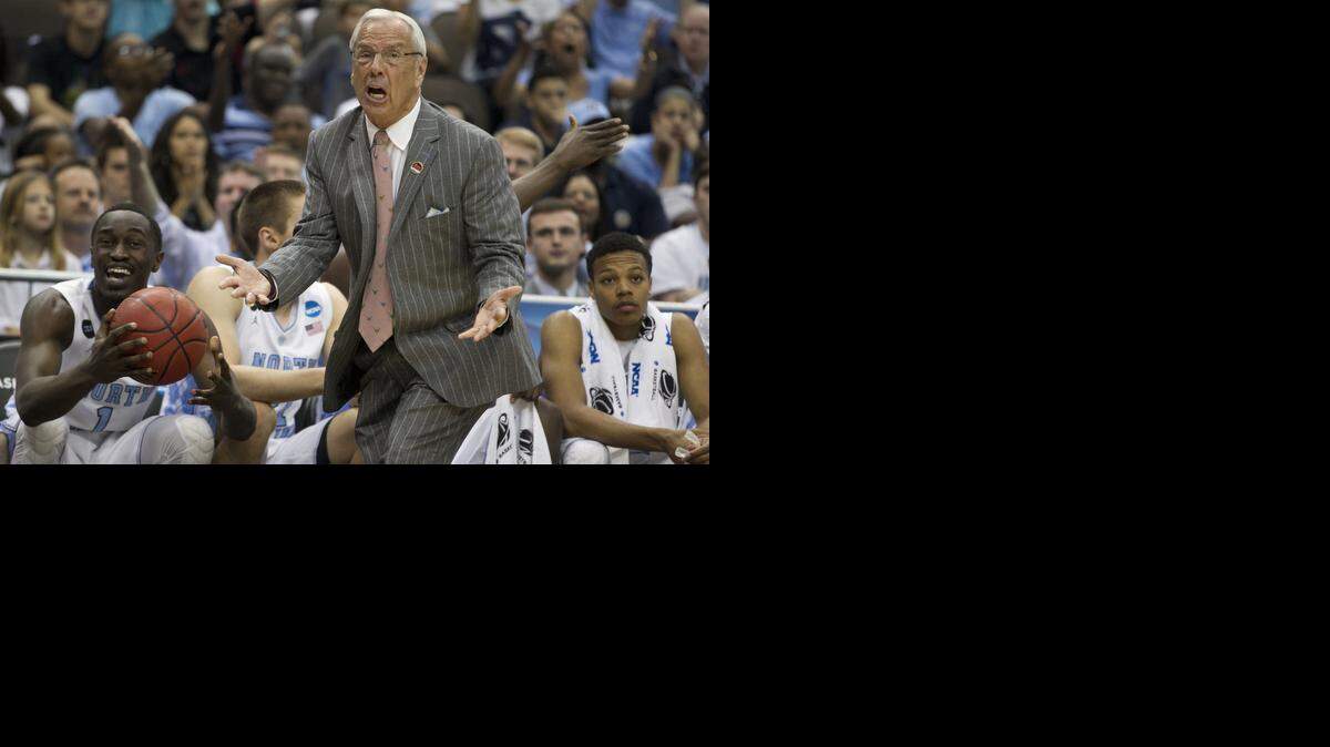 
North Carolina coach Roy Williams argues with the officials after a call against his team during the first half against Harvard.
