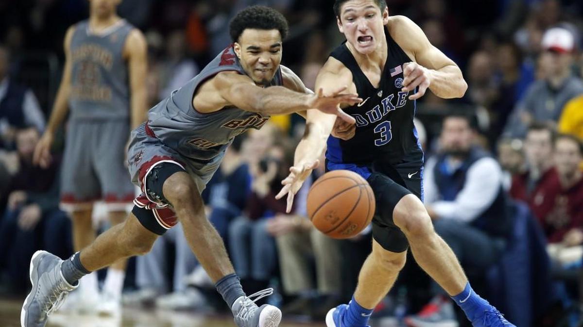 Boston College's Jerome Robinson (1) and Duke's Grayson Allen (3) chase a loose ball during the second half in Boston on Dec. 9, 2017.