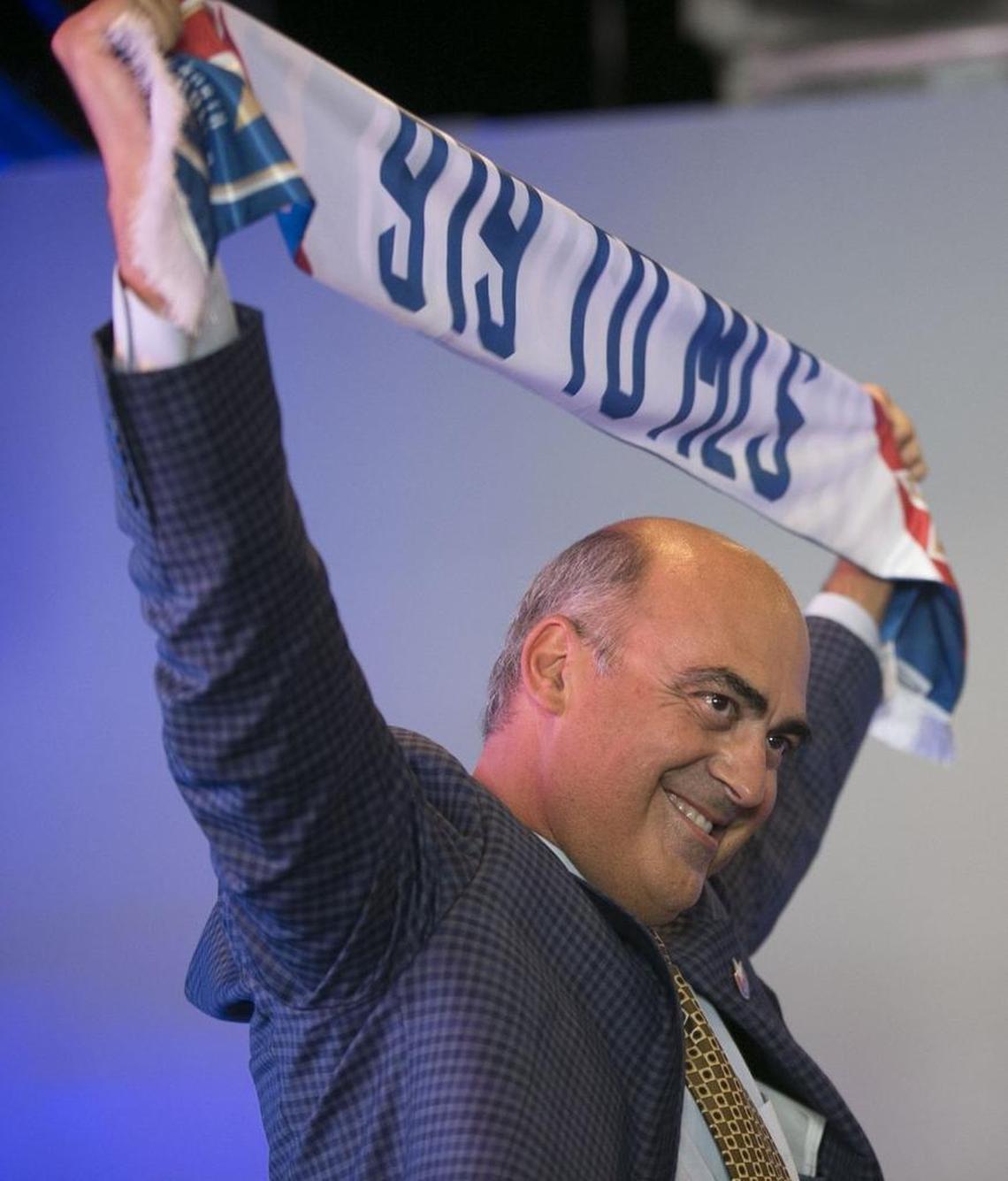 North Carolina FC president Steve Malik addresses a rally of soccer fans at City Market to promote Raleigh as a MLS expansion city in July.