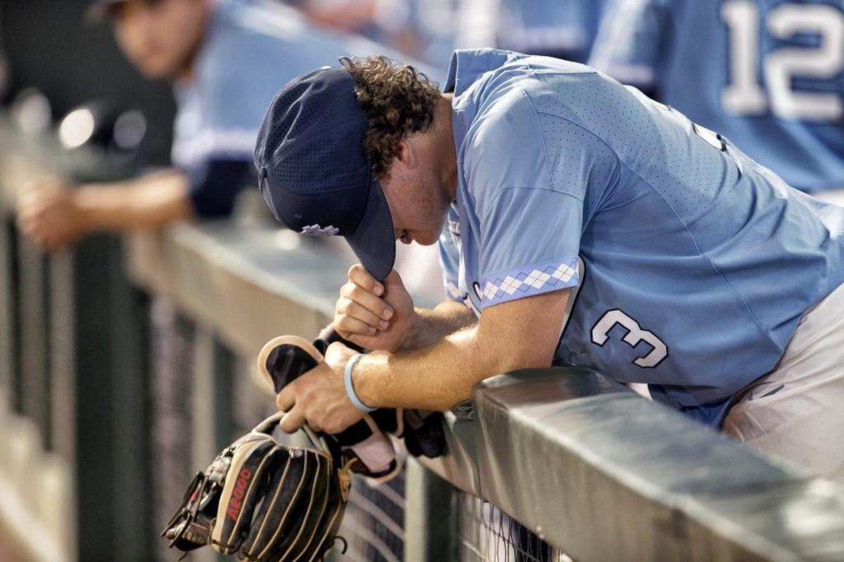 North Carolina’s Kyle Dartes (3) hangs his head in the dugout following the Tar Heelsí 2-1 loss to Davidson in the NCAA regional baseball game on Sunday, June 4, 2017 at Boshamer Stadium in Chapel Hill, N.C. The loss ends the Tar Heelsí season and their hopes of returning to the College World Series.