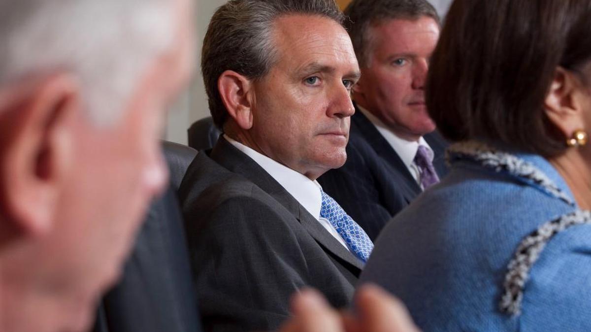 University of North Carolina athletic director Bubba Cunningham (center) and Ken Wainstein (right) listen to UNC chancellor Carol Folt answer questions during a meeting with the staff of the News & Observer on Thursday, October 23, 2014 in Raleigh, N.C.
