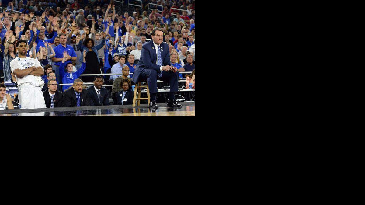 
Duke center Jahlil Okafor  and head coach Mike Krzyzewski watch as Tyus Jones shoots a foul shot late in the game. Duke defeated Utah 63-57 on Friday in the semifinal of the NCAA South Region at the NRG Stadium in Houston.
