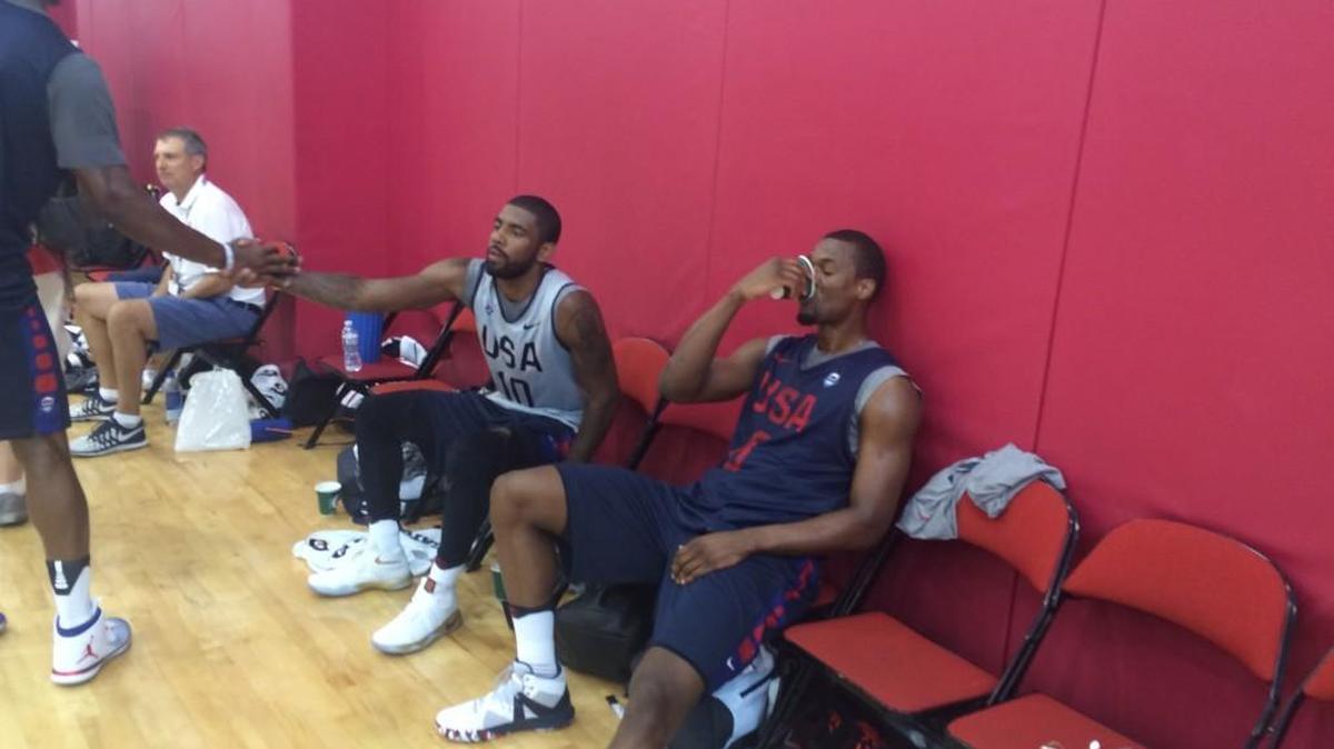 U.S. teammates and old friends Kyrie Irving (left) and Harrison Barnes relax after Tuesday’s practice at the USA Basketball training camp in Las Vegas. Irving (Duke) and Barnes (North Carolina) never played in college but have competed for the past two NBA titles and are finally teammates for the United States.