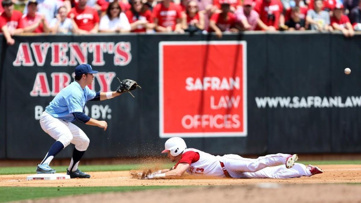 N.C. State outfielder Brock Deatherage (13) slides into third base for a triple as North Carolina third baseman Kyle Datres (8) looks to receive a throw during the Wolfpack's 10-1 win over North Carolina on Saturday, May 21, 2016 at Doak Field in Raleigh.