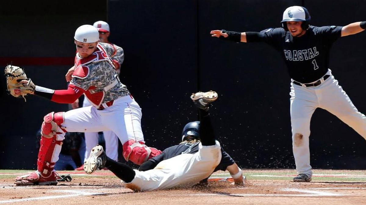 Coastal Carolina's Zach Remillard (7), center, scores before N.C. State's Andrew Knizner (11) can make the tag as Michael Paez (1) signals he is safe on a hit by Seth Lancaster in the ninth inning during Coastal Carolina's 7-5 victory over N.C. State in the Raleigh Regional of the 2016 NCAA Division I Men‚Äôs Baseball Championship at Doak Field in Raleigh, N.C., Tuesday, June 7, 2016.