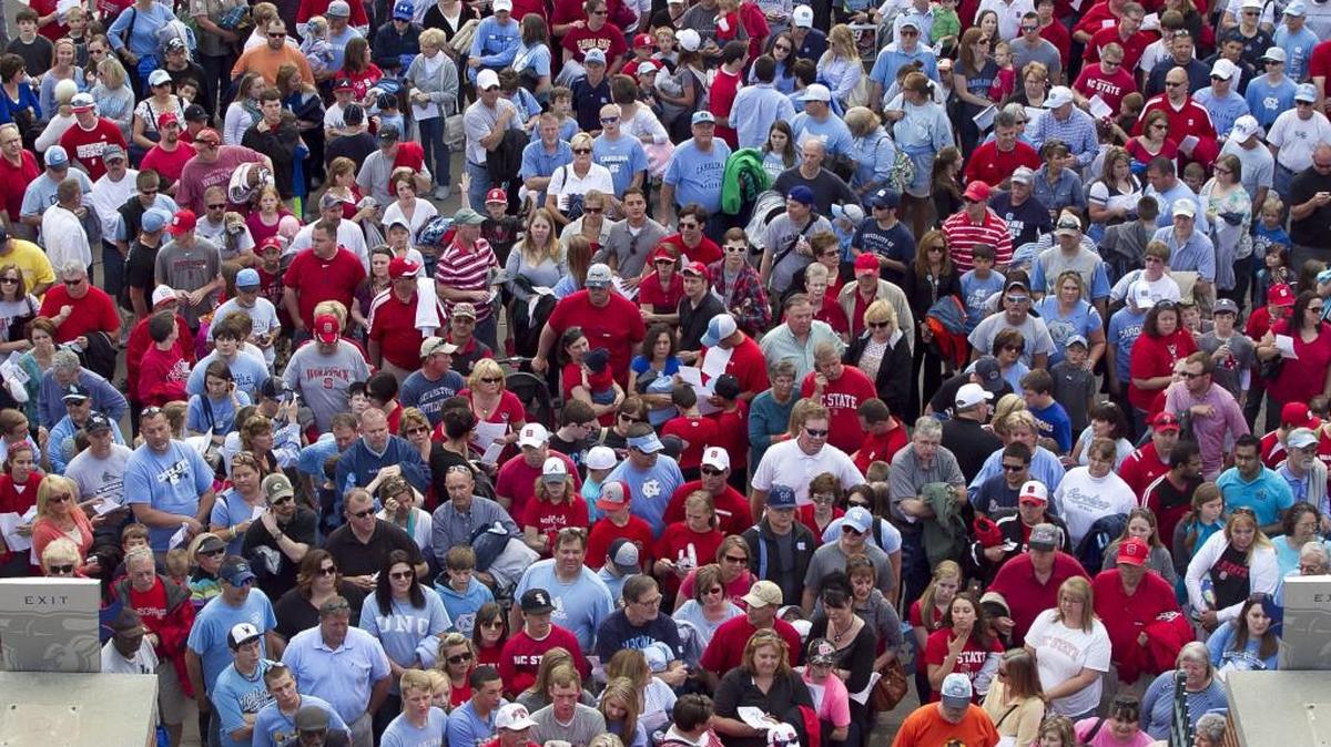 Hundreds of North Carolina and N.C. State fans wait to enter the Durham Bulls Athletic Park on May 25, 2013 to watch the two Triangle schools face off during the ACC Baseball Championship at the Durham Bulls Athletic Park.