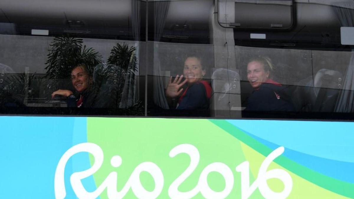 Athletes from the US Olympic team wave from a bus to locals after their arrival to Antonio Carlos Jobim International Airport in Rio de Janeiro, Brazil, on July 29. The Olympic and Paralympic Games Rio 2016 will be held in Brazil from August 5 to 21 and September 7 to 18, respectively. / AFP PHOTO / VANDERLEI ALMEIDAVANDERLEI ALMEIDA/AFP/Getty Images