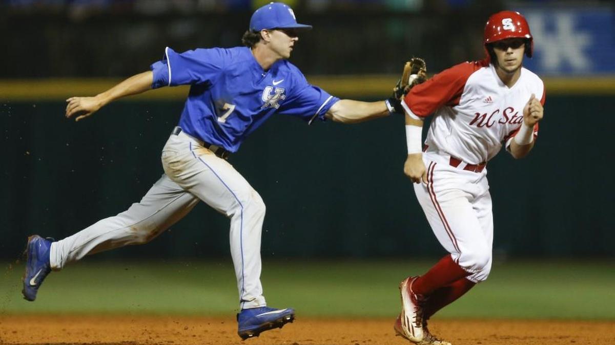 Connor Heady of the Kentucky Wildcats tags out Will Wilson of the N.C. State Wolfpack during a rundown in the final game of the Lexington NCAA Regional on Monday.