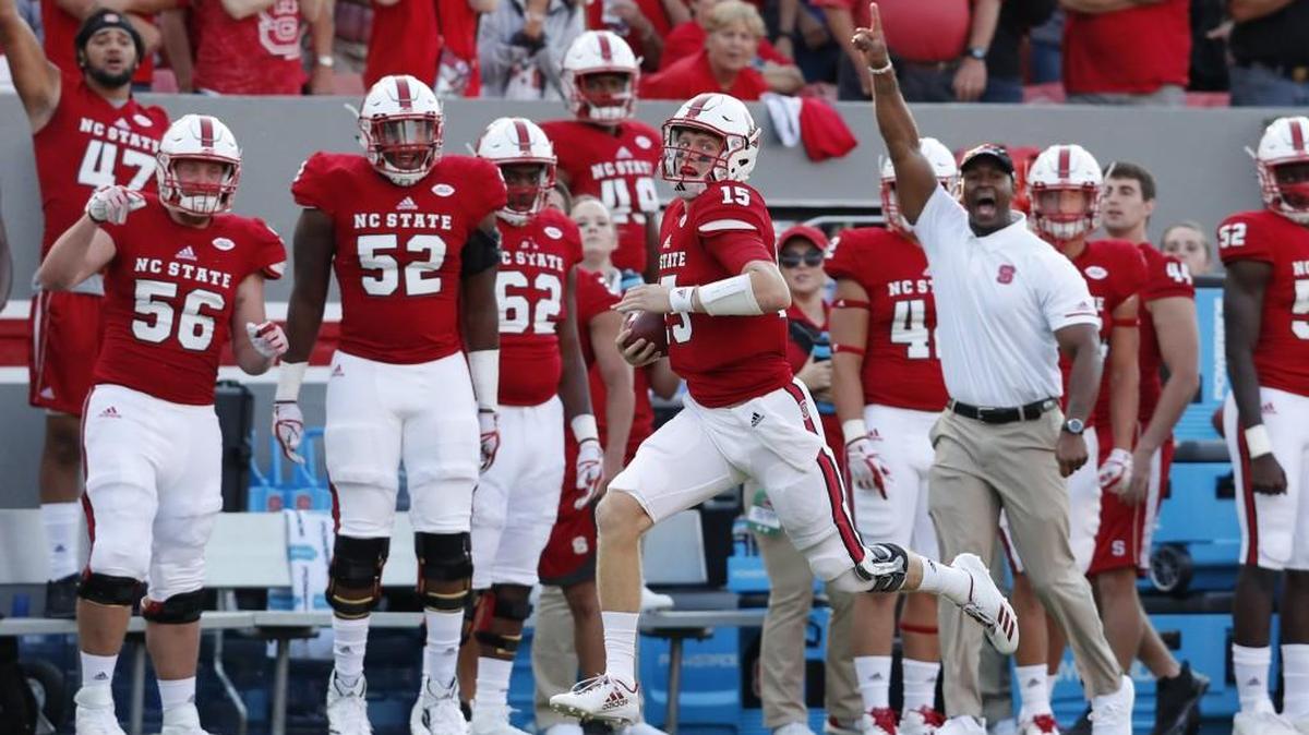 N.C. State quarterback Ryan Finley (15) makes a long run against Marshall at Carter-Finley Stadium on Sept. 9, 2017.
