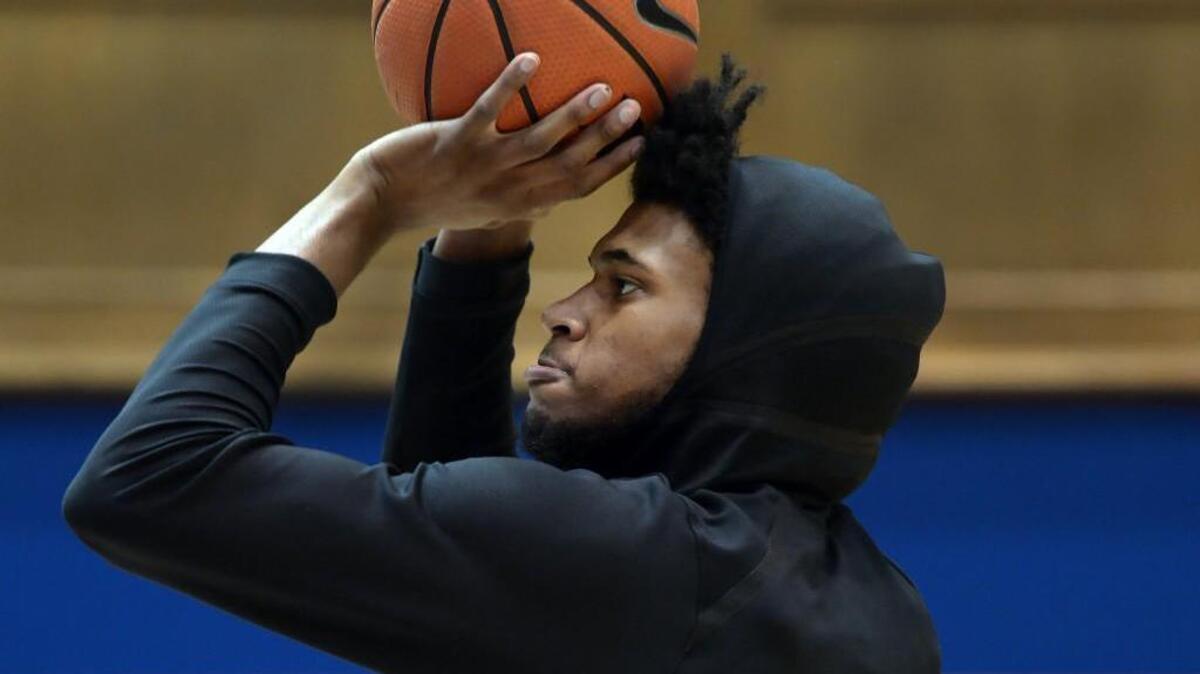 Duke forward Marvin Bagley III (35) shoots baskets from the floor about two hours before gamete. Duke announced Bagley will mis his fourth straight game due to a knee sprain. Duke battled Louisville at Cameron Indoor Stadium In Durham, N.C. Wednesday, Feb. 21, 2018