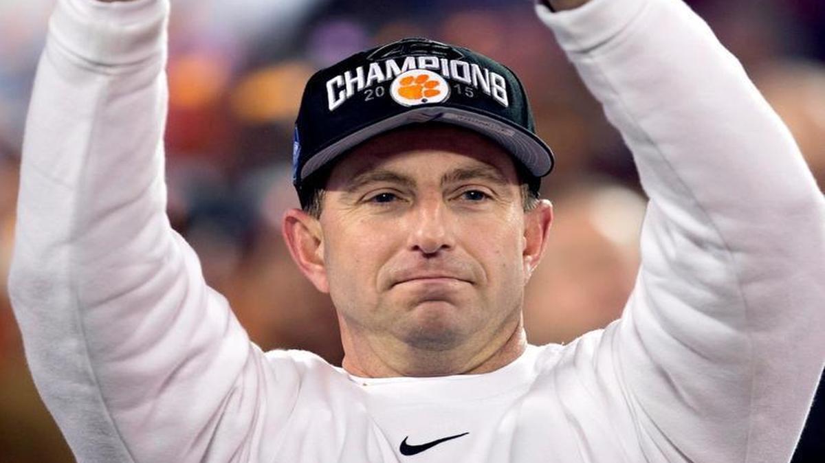 Clemson coach Dabo Swinney hoists the ACC Championship trophy after the Tigers 45-37 victory over North Carolina on Saturday, December 5, 2015 at Bank of America Stadium in Charlotte, N.C.