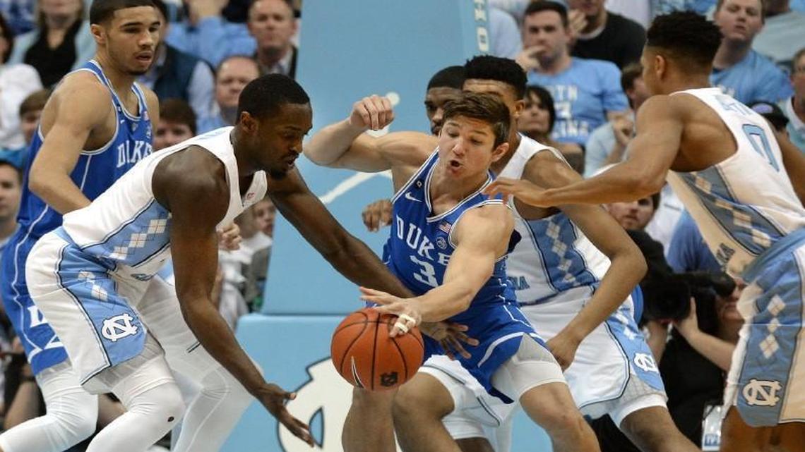 Duke’s Grayson Allen knocks the ball away from UNC’s Theo Pinson in the first half at the Smith Center in Chapel Hill.