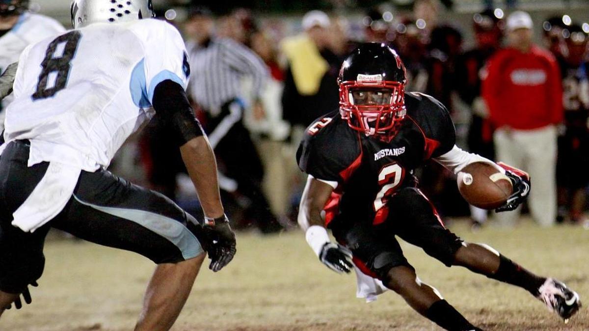 Middle Creek's Chris Hubert, right, prepares to take on Panther Creek's Brandon Little. PHOTO BY R AY BLACK III