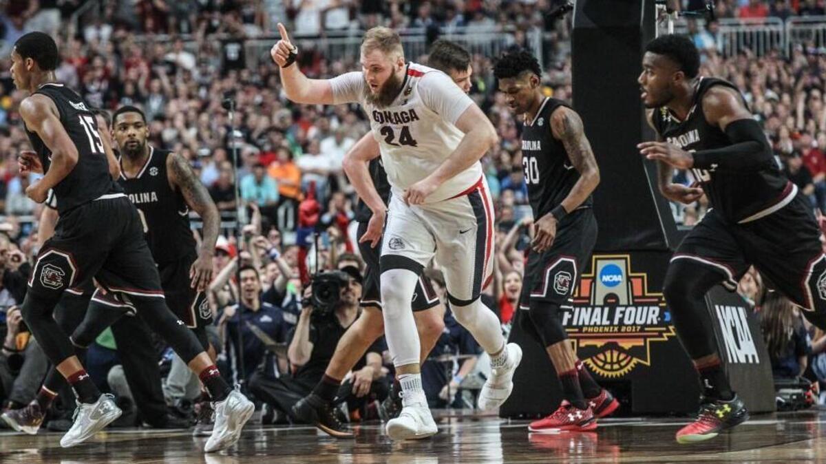Gonzaga’s Przemek Karnowski reacts after a dunk in the Final Four. The Bulldogs face UNC in the national title game Monday.