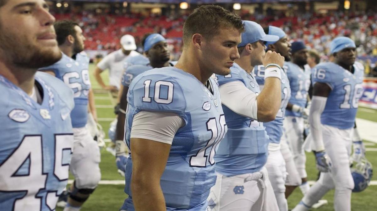 North Carolina quarterback Mitch Trubisky (10) and his teammates leave the field dejected following their 33-24 loss to Georgia on Saturday at the Georgia Dome in Atlanta.