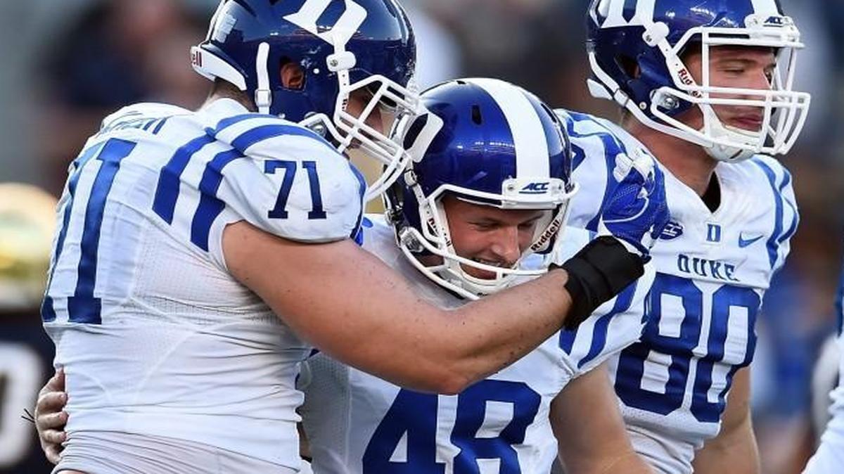 Duke kicker AJ Reed (48) is congratulated by teammates after kicking the winning field goal against the Notre Dame in South Bend, Ind.