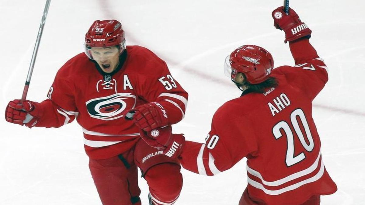 The Canes' Jeff Skinner (53) celebrates his goal with teammate Sebastian Aho (20) during the third period against the Montreal Canadiens at PNC Arena in Raleigh.