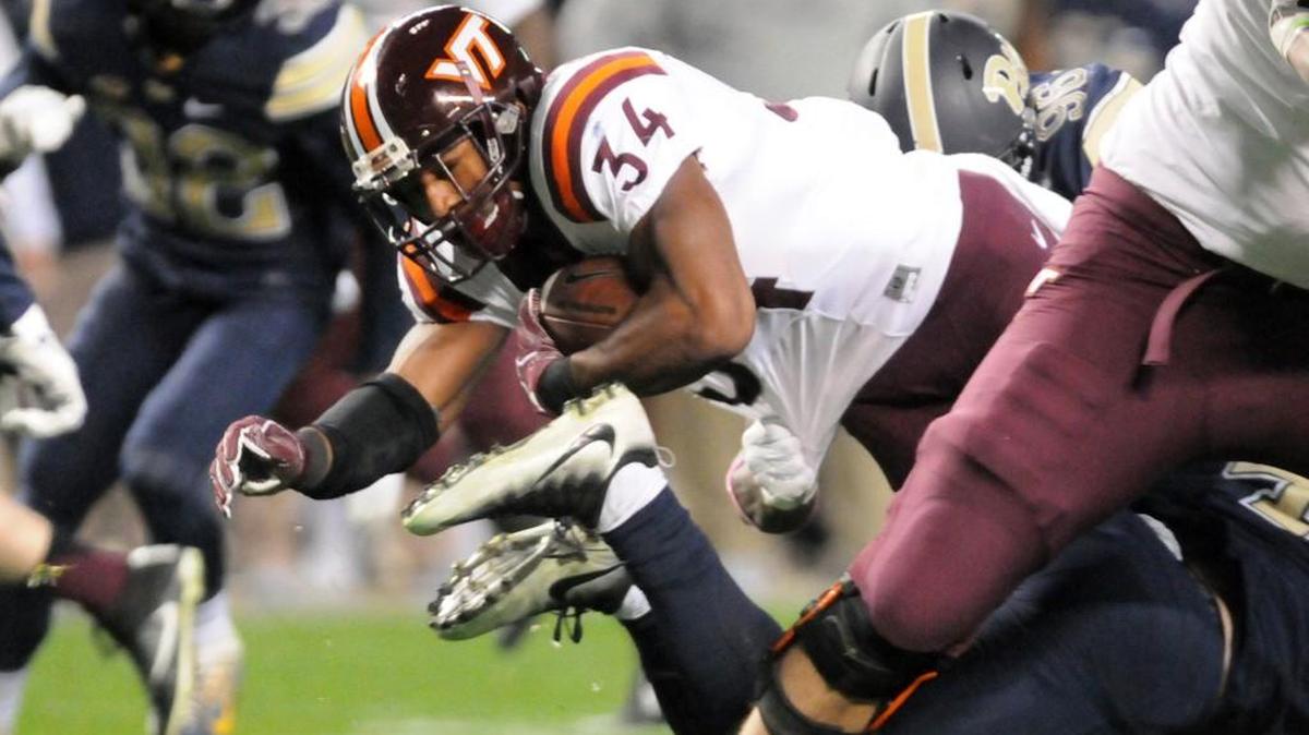 Virginia Tech Travon McMillian, center, picks up yardage against Pittsburgh on Oct. 27. The Pitt loss means North Carolina needs a miracle to win the ACC’s Coastal Division.