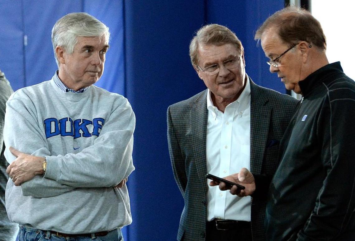 Duke athletic director Kevin White, left, talks with ACC commisioner John Swofford, middle, and Duke football coach David Cutcliffe, right during Duke football pro day in March. White released a statement Tuesday expressing his concerns about name, image and likeness legislation. 