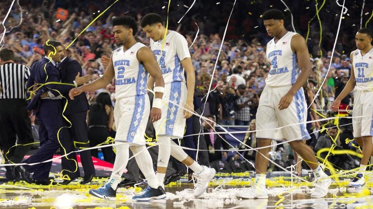 From left, North Carolina's Joel Berry II (2), Justin Jackson (44), Isaiah Hicks (4) and Brice Johnson (11) walk off the court after Villanova's 77-74 victory in the finals of the 2016 NCAA Division I Men's Basketball Championship at NRG Stadium in Houston on April 4, 2016.