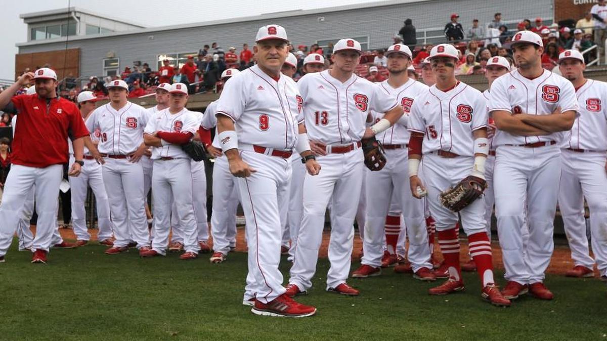 N.C. State head coach Elliott Avent and the team watch pregame activities before the Wolfpack's game against UNC at Doak Field in Raleigh Friday, May 20, 2016.