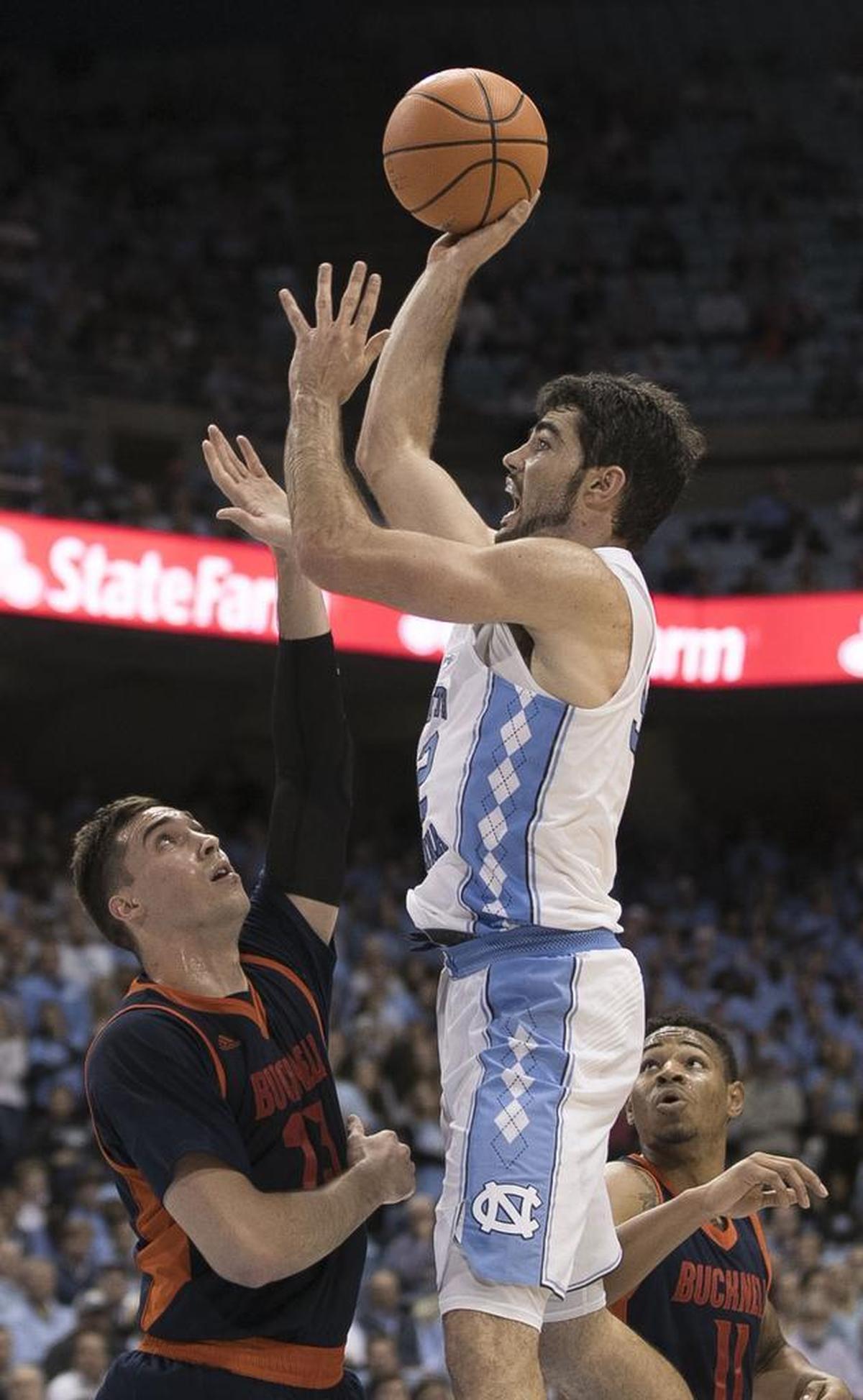 North Carolina’s Luke Maye (32) puts up a shot over Bucknell’s Bruce Moore (13) during the second half on Wednesday, November 15, 2017 at the Smith Center in Chapel Hill, N.C. Maye lead the Tar Heels with 20 points in their 93-81 victory.