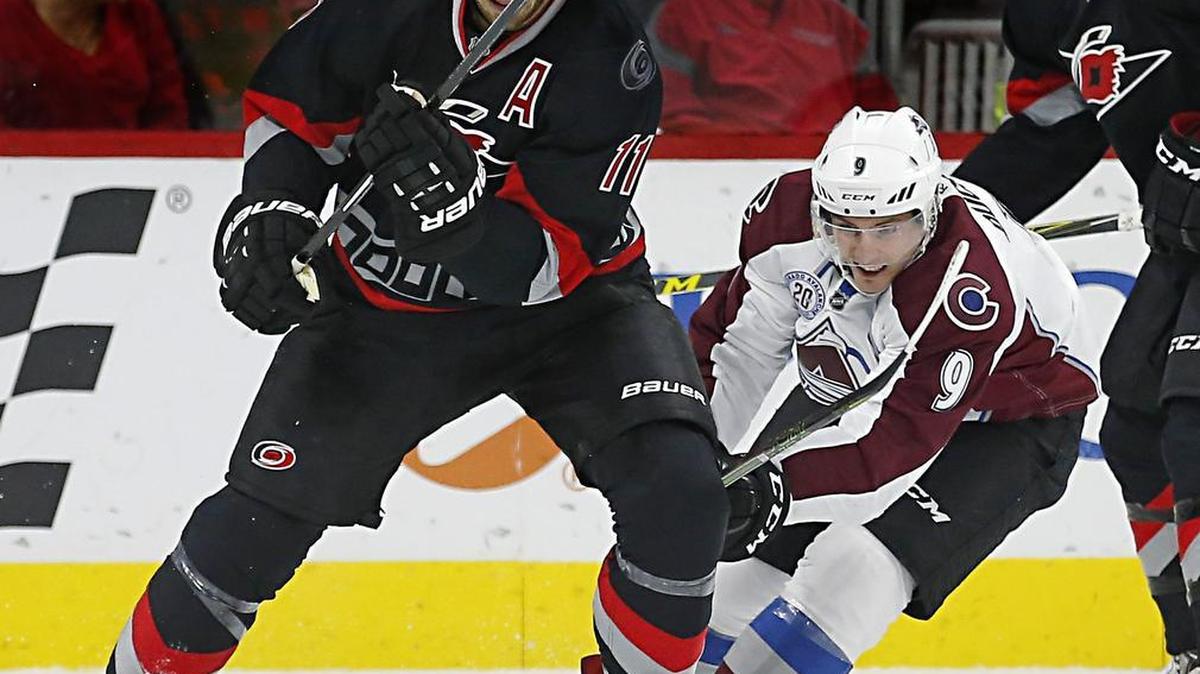 The Canes’ Jordan Staal (11) battles Matt Duchene (9) for the puck during the first period of an NHL game played between the Carolina Hurricanes and the Colorado Avalanche at PNC Arena on Oct. 30, 2015.