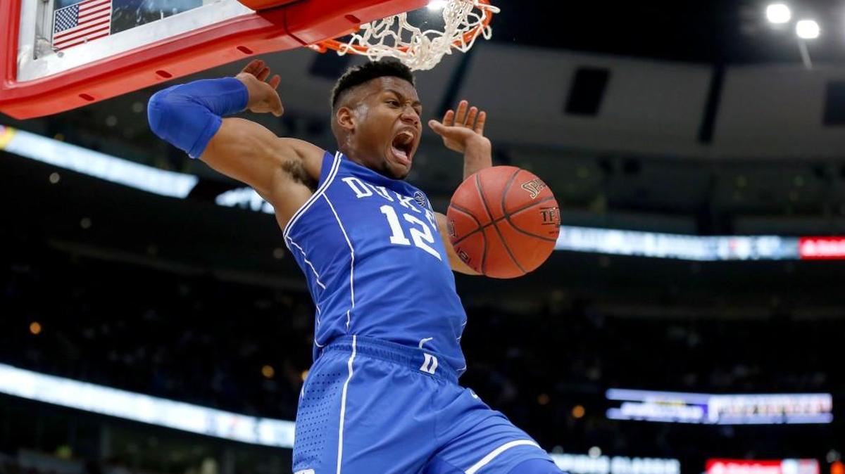 Duke forward Javin DeLaurier reacts after dunking the ball during the closing seconds as Duke defeated Michigan State 88-81 Tuesday.