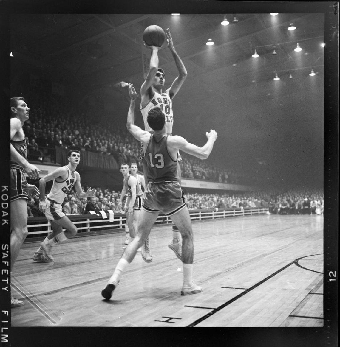 North Carolina’s Lennie Rosenbluth shoots over a Wake Forest player during the 1957 ACC Tournament.