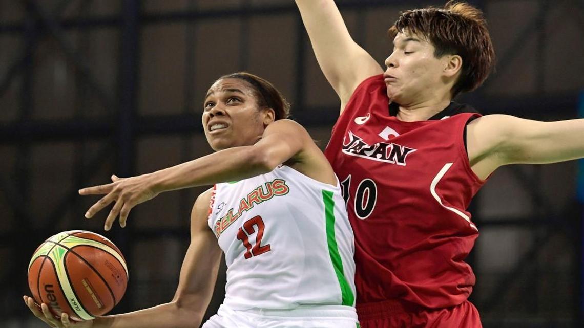 Belarus' guard Lindsey Harding, left, jumps for a basket by Japan's power forward Ramu Tokashiki during a Women's round Group A basketball match between Belarus and Japanat the Youth Arena in Rio de Janeiro on August 6, 2016 during the Rio 2016 Olympic Games.