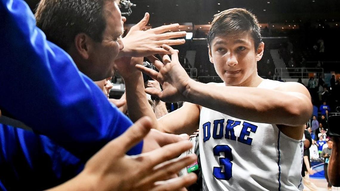 Duke’s Grayson Allen slapas hands with the fans after the Blue Devils defeated Yale to advance to the Sweet Sixteen at the Dunkin' Donuts Center in Providence, RI. Saturday, March 19, 2016.