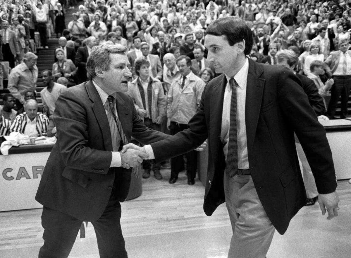 UNC Coach Dean Smith, left, shakes hands with Duke Coach Mike Krzyzewski after the Tar Heels defeated the Blue Devils in the first game in the Dean E. Smith Student Activities Center on January 18, 1986.